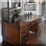 F24. Desk. 32”h x 66”w x 31”d 